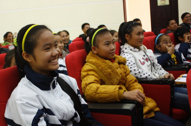 Children watching their final films with friends