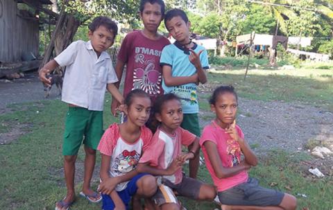 Children pose for the camera. 