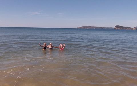 Jess swimming at the beach